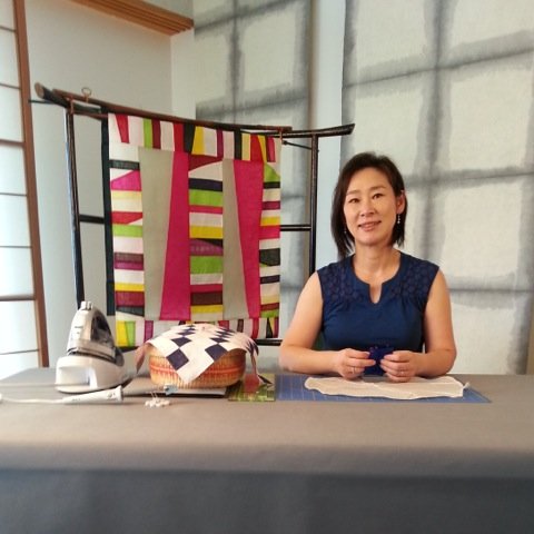 artist with Korean textiles