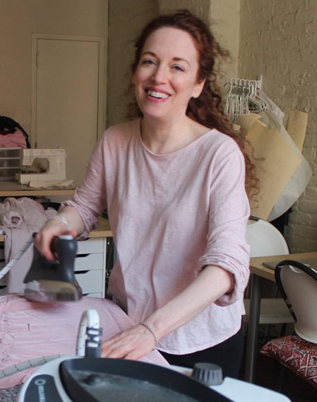Artist and Sewist Sarah Kate Beaumont ironing her fabric