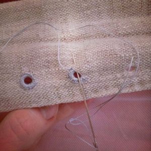Artist and Sewist Sarah Kate Beaumont sewing outward Loop eyelets