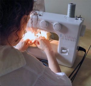 Artist and Sewist Sarah Kate Beaumont sewing